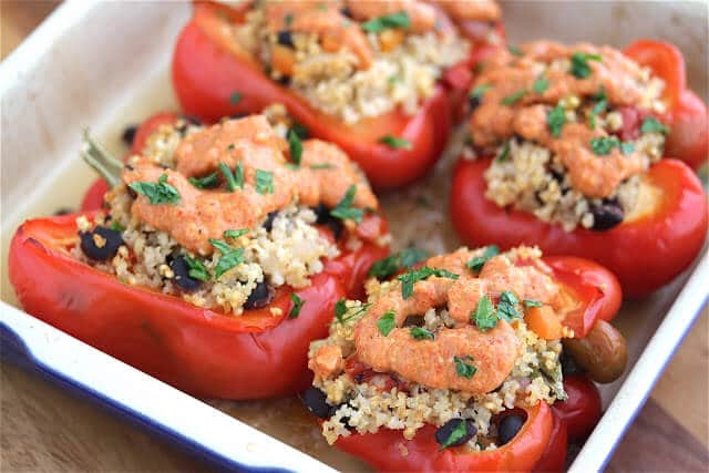 Vegetarian Stuffed Peppers - stuffed with millet and black beans, and topped with roasted red pepper carrot pesto - these are vegan-adaptable and gluten-free