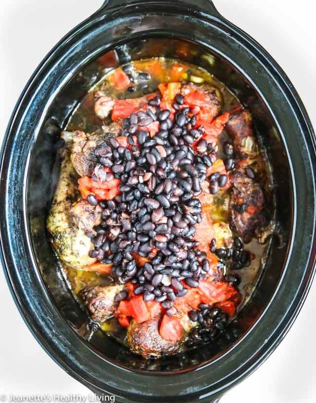Crock Pot Jamaican Spiced Chicken Stew - this Caribbean themed chicken recipe is spiced with curry powder, thyme, allspice and red pepper flakes. It's delicious and great served with rice and a simple green salad