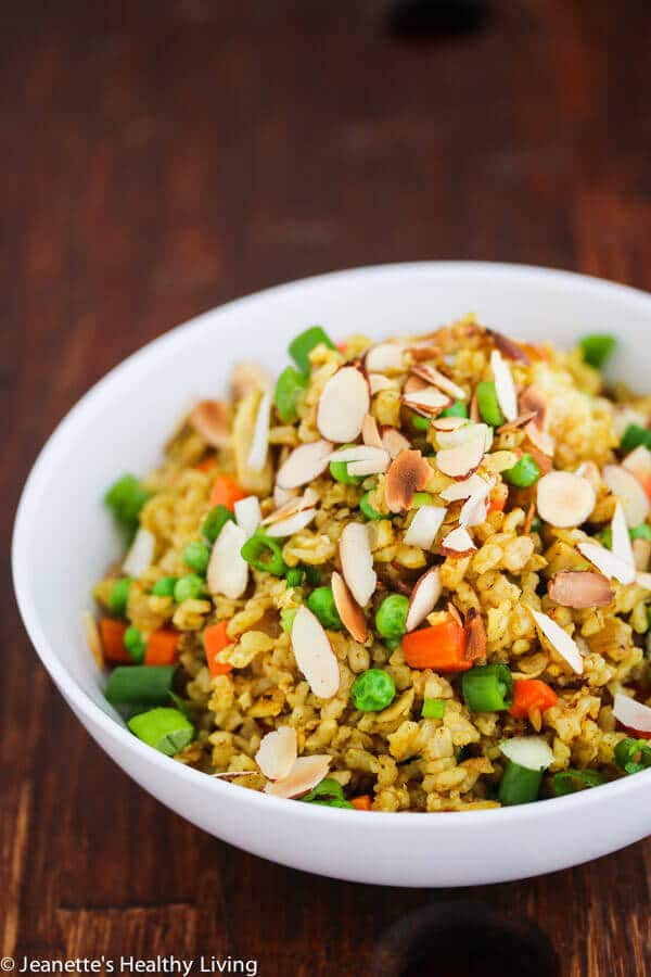 Chicken Curry Fried Rice - a quick, easy and healthy one-pan dinner made with leftover cooked chicken, brown rice, carrots and peas. Toasted almonds make a nice crunchy topping.