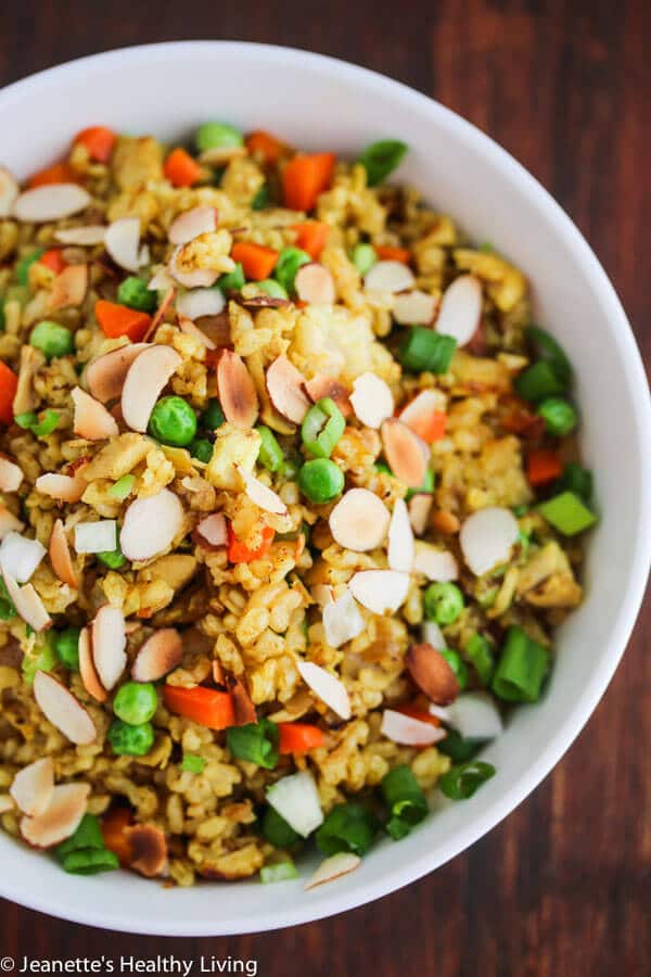 Chicken Curry Fried Rice - a quick, easy and healthy one-pan dinner made with leftover cooked chicken, brown rice, carrots and peas. Toasted almonds make a nice crunchy topping.