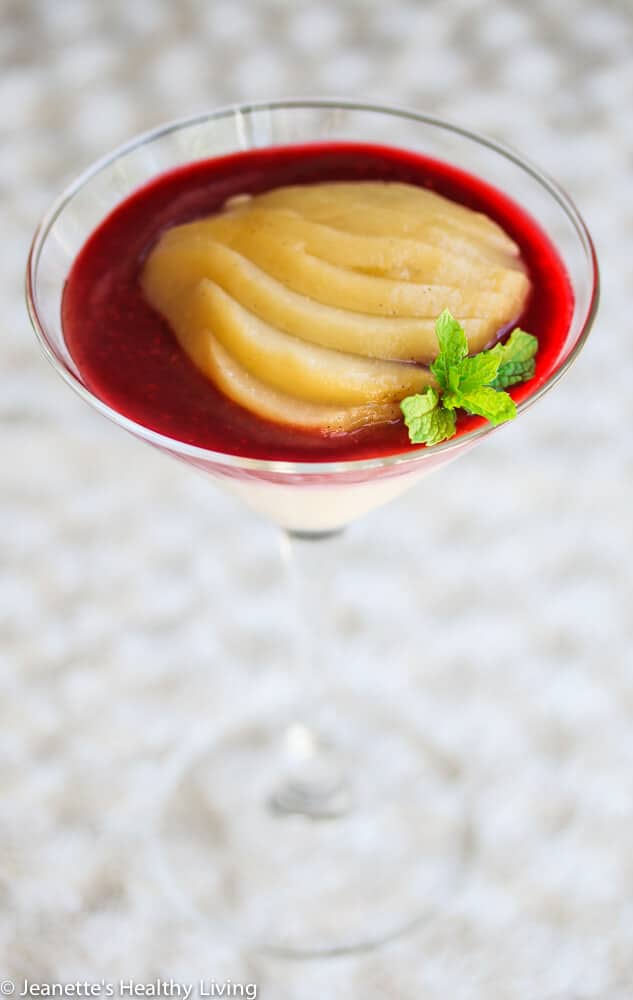 Vanilla Pear Raspberry Panna Cotta - so light and creamy, this elegant dessert is low-calorie and low-fat, made with cashew milk and Greek yogurt. Vanilla poached pears and raspberry puree are the perfect match.