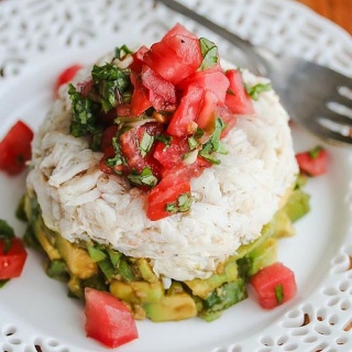 Crabmeat Avocado Tomato Basil Appetizer with Wasabi Soy Dressing - impress your guests with this beautiful presentation. The wasabi soy dressing spices things up a bit