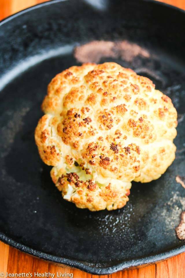 Roasted Whole Cauliflower with Pistachio Herb Sauce - this is so easy to make; you can present the whole roasted cauliflower and break it up at the table