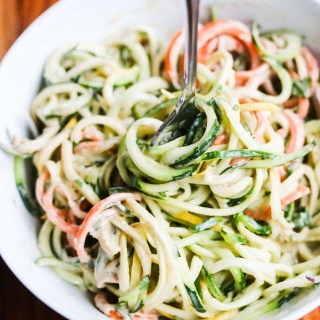Zucchini Noodles with Sunflower Seed Butter Dressing - this dressing is SO delicious! Made with sunflower seed butter and coconut milk, it is rich and creamy.