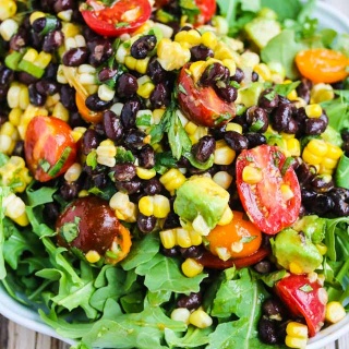 Chipotle Black Bean Corn Tomato Avocado Salad - this can be eaten as a dip or a salad - perfect for summer barbecues and picnics!