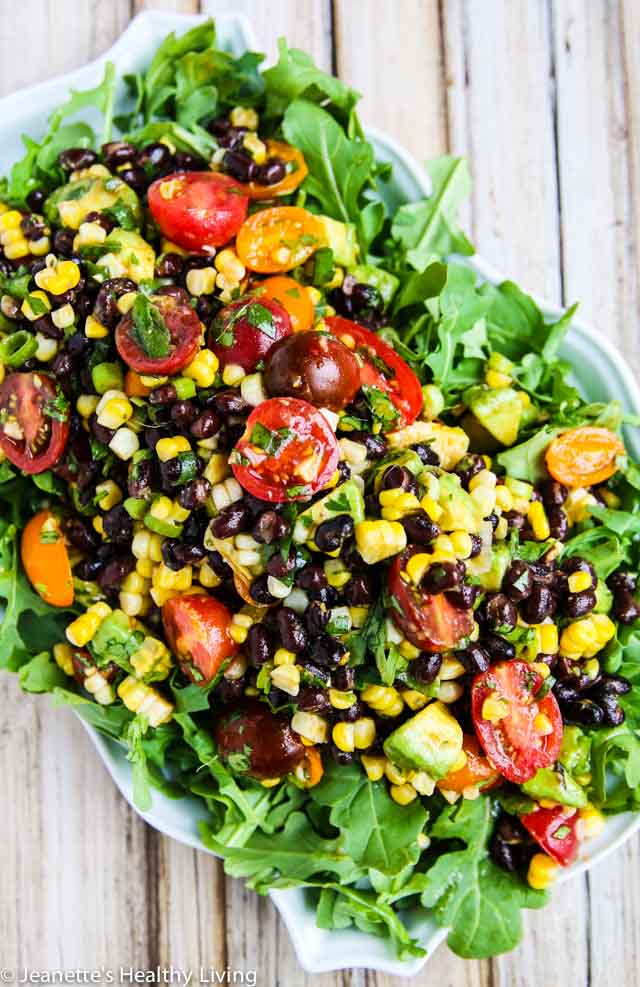 Chipotle Black Bean Tomato Corn Avocado Salad - serve as a dip or on a bed of baby arugula for a complete salad - perfect for summer barbecues and picnics!