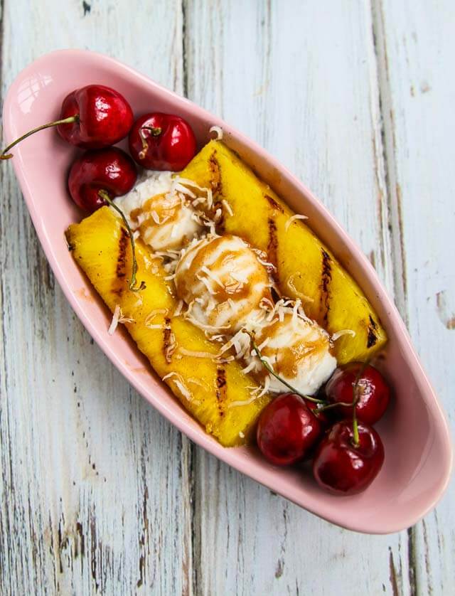 Grilled Pineapple Spllit Sundae - this tropical sundae features sweet grilled pineapple and a honey cinnamon nutmeg ice cream sauce ~ https://jeanetteshealthyliving.com