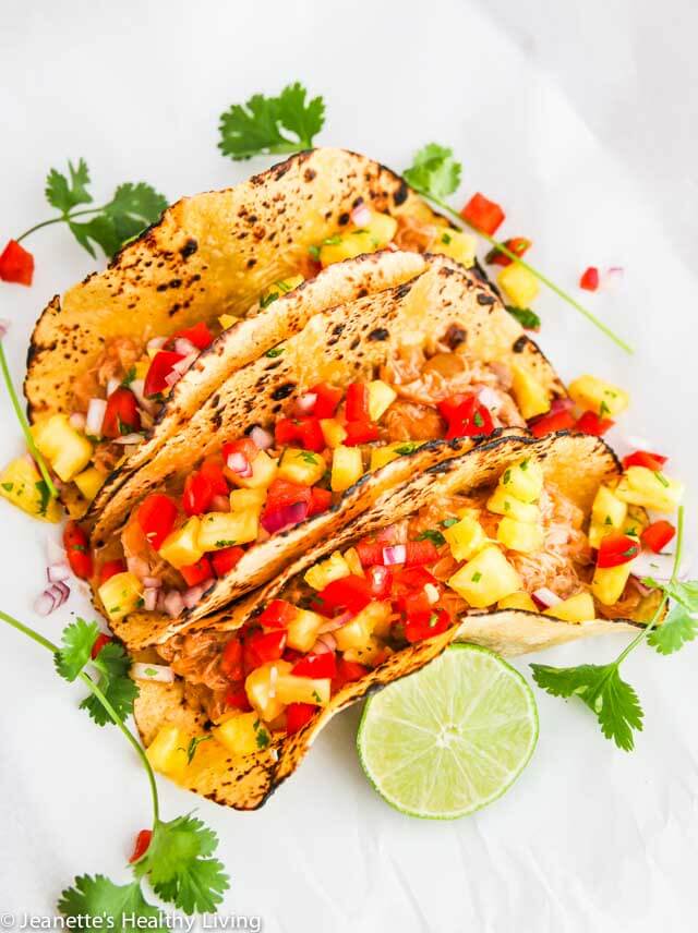 Crockpot Shredded Hawaiian Chicken Tacos - the filling for these tacos is sweet and tangy. Versatile too - can also be served in a rice bowl or on a bun with some slaw ~ https://jeanetteshealthyliving.com
