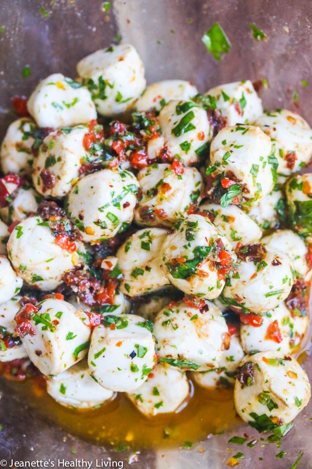 Marinated Mozzarella Balls - always a party favorite - super easy and delicious with sun dried tomatoes, roasted red peppers, basil and parsley
