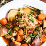 Slow Cooker Chicken Vegetable Stew - This stew will warm your belly and make your kitchen smell amazing! Braised in a tomato-based sauce and flavored with rosemary, thyme and sage, it