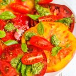 Heirloom Tomato Salad with Basil Mint Vinaigrette - this fresh tomato salad features beautiful heirloom tomatoes at their peak ripeness and a vibrant fresh basil mint dressing https://jeanetteshealthyliving.com
